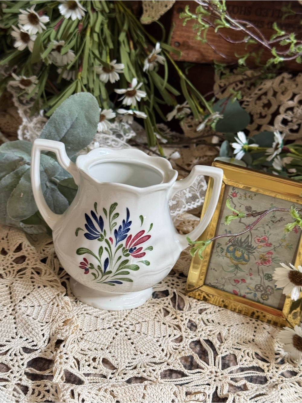 White Floral Double-Handled Ceramic Vase with Blue and Pink Accents